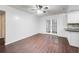 Dining room with dark brown tile floors and French doors at 3050 Cross Fox Dr, Mulberry, FL 33860