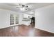 Bright dining room with wood-look floors and access to kitchen at 3050 Cross Fox Dr, Mulberry, FL 33860