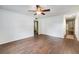 Bright living room featuring dark brown tile floors and a ceiling fan at 3050 Cross Fox Dr, Mulberry, FL 33860