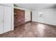 Sunroom with brick wall, tile floors, and exterior access at 3050 Cross Fox Dr, Mulberry, FL 33860