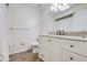 Simple bathroom with granite countertop and white cabinets at 3050 Cross Fox Dr, Mulberry, FL 33860