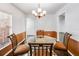 Bright dining area with a glass table and four chairs at 3050 Cross Fox Dr, Mulberry, FL 33860