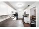 Kitchen boasts white cabinets, dark countertops, and an eat-in area at 3050 Cross Fox Dr, Mulberry, FL 33860