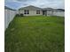 Large backyard with lush grass and a spacious area at 1036 Mattie Pointe Way, Auburndale, FL 33823