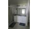 Double vanity bathroom with large mirror and shower at 1036 Mattie Pointe Way, Auburndale, FL 33823