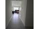 Bright hallway with tile floors leading to living area at 1036 Mattie Pointe Way, Auburndale, FL 33823