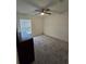 Spacious bedroom with ceiling fan and neutral carpeting at 1036 Mattie Pointe Way, Auburndale, FL 33823