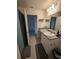 Bathroom boasts granite countertop and updated vanity at 1036 Mattie Pointe Way, Auburndale, FL 33823