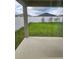 Grass backyard with covered patio and privacy fence at 1036 Mattie Pointe Way, Auburndale, FL 33823