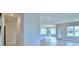 Bright hallway with views of the living room and kitchen at 1476 Leamington Lane, Winter Haven, FL 33884