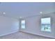 Spacious bedroom with two large windows at 1476 Leamington Lane, Winter Haven, FL 33884