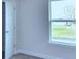 Well-lit bedroom featuring a window and closet at 1476 Leamington Lane, Winter Haven, FL 33884