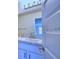 Bright bathroom with double vanity and modern fixtures at 1476 Leamington Lane, Winter Haven, FL 33884