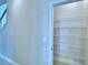 Walk-in pantry with ample shelving at 1476 Leamington Lane, Winter Haven, FL 33884
