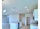 Open concept kitchen with an island and modern appliances at 1476 Leamington Lane, Winter Haven, FL 33884