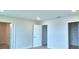 Simple bedroom with doors to closets and hallway at 1476 Leamington Lane, Winter Haven, FL 33884