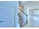 Elegant staircase leading to the upper level of the home at 1476 Leamington Lane, Winter Haven, FL 33884