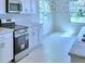 Bright kitchen featuring white cabinets and modern stovetop at 1476 Leamington Lane, Winter Haven, FL 33884