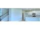 Modern kitchen with white cabinetry and granite countertops at 1476 Leamington Lane, Winter Haven, FL 33884