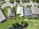 Aerial view of homes near a pond at 4104 Martindale Loop, Winter Haven, FL 33884