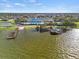 Community clubhouse and lakefront view with docks at 4104 Martindale Loop, Winter Haven, FL 33884