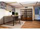 Home office featuring a large desk, shelving, and wood floors at 4822 Melody Ln, Lakeland, FL 33805