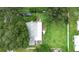 Aerial view of a single-story home with a large backyard and surrounding trees at 4822 Melody Ln, Lakeland, FL 33805