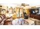 Cozy game room with leather seating, large screen TV, and musical instruments at 4822 Melody Ln, Lakeland, FL 33805