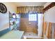 Bathroom with walk-in shower, tiled walls, and built-in shelving at 4822 Melody Ln, Lakeland, FL 33805