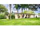 Charming single-story home with a well-maintained lawn and landscaping at 4822 Melody Ln, Lakeland, FL 33805