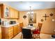 Cozy dining area with a round table and chairs, adjacent to the kitchen at 4822 Melody Ln, Lakeland, FL 33805