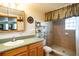 Bathroom with a double vanity and large mirrored medicine cabinets at 4822 Melody Ln, Lakeland, FL 33805