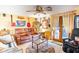 Cozy game room with leather seating, large screen TV, and musical instruments at 4822 Melody Ln, Lakeland, FL 33805