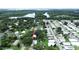 Property location shown in a wide aerial view of the neighborhood and lake at 4822 Melody Ln, Lakeland, FL 33805