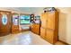 Inviting entryway with wood-toned storage cabinets and tiled floor at 4822 Melody Ln, Lakeland, FL 33805