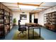 Spacious home office with rustic wood furniture and shelving at 4822 Melody Ln, Lakeland, FL 33805