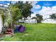 Large backyard with grassy area and Airstream trailer at 4822 Melody Ln, Lakeland, FL 33805