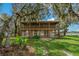 Elevated home with screened porch overlooking the lake at 3038 Spirit Lake Dr, Winter Haven, FL 33880