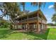 Two-story house with screened porch and fenced yard at 3038 Spirit Lake Dr, Winter Haven, FL 33880