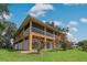 Two-story house with screened porch and beautiful landscaping at 3038 Spirit Lake Dr, Winter Haven, FL 33880