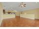Open concept living room and kitchen with tile floors at 3038 Spirit Lake Dr, Winter Haven, FL 33880