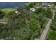 Aerial view showing property's waterfront lot and surrounding vegetation at 3038 Spirit Lake Dr, Winter Haven, FL 33880