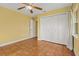 Bright bedroom with tile floors and a large closet at 3038 Spirit Lake Dr, Winter Haven, FL 33880
