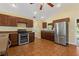 Kitchen boasts stainless steel appliances and ample dark wood cabinetry at 3038 Spirit Lake Dr, Winter Haven, FL 33880