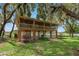 Two-story house with screened porch overlooking the water at 3038 Spirit Lake Dr, Winter Haven, FL 33880