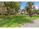 Landscaped front yard with mature trees and a mailbox at 3038 Spirit Lake Dr, Winter Haven, FL 33880