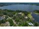 Aerial view of house and surrounding neighborhood near lake at 3038 Spirit Lake Dr, Winter Haven, FL 33880