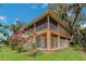 Two-story house with screened porch and lush landscaping at 3038 Spirit Lake Dr, Winter Haven, FL 33880