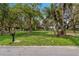 Landscaped lot with a lake view and mature trees at 3038 Spirit Lake Dr, Winter Haven, FL 33880