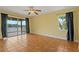 Spacious bedroom with tile floors, ceiling fan, and access to balcony at 3038 Spirit Lake Dr, Winter Haven, FL 33880